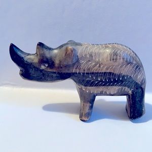 Rhinoceros sculptor etched in coloured stone